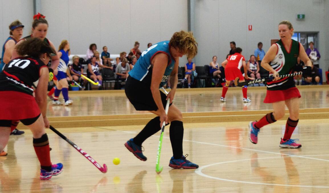 NO QUARTER GIVEN: Action from last year's Women's Masters Indoor Hockey Championships, Goulburn 1 versus Nepean 2 in the Veolia Arena. Photo: Darryl Fernance
