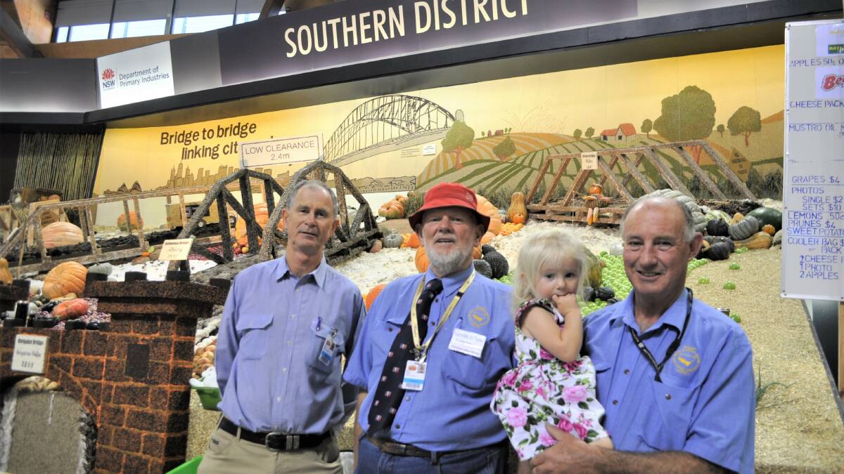ADVOCATES FOR SOUTHERN NSW: David Cullen, Kevin Allen and Kenny Hewitt (with his daughter) at the Southern District Exhibit with their immaculate visual display behind them. Photo: Toby Vue