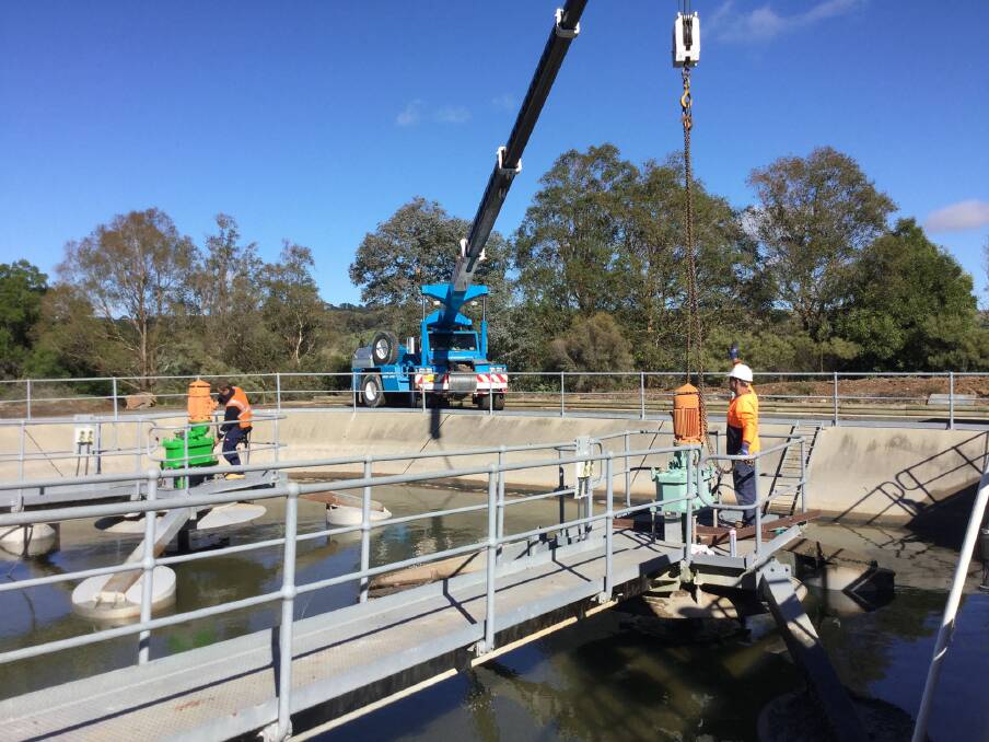 One aerator gearbox is removed via crane at the Crookwell Sewage Treatment Plant, while another refurbished aerator gearbox is installed. Photo: Danielle Crosbie