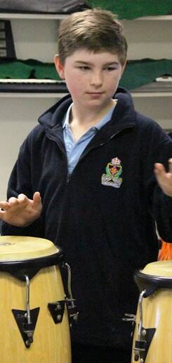 YEAR SIX TASTER: Lachlan Vallender kept the beat going
in Mrs Woolley’s music taster lesson.