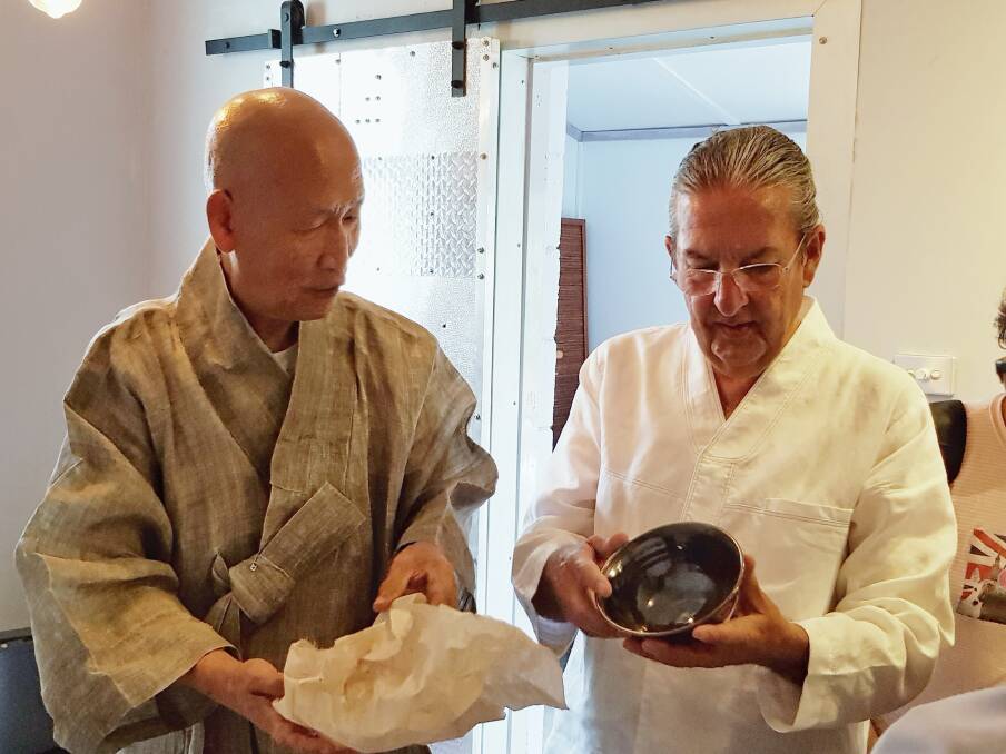 A GIFT: Stephen Carroll from the Tea House and Gallery in Crookwell received a Korean Tea Bowl as a gift from the Venerable Ki Hu at a recent tea ceremony.