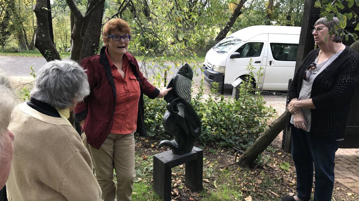 Anna Pye (centre) talking to Lesley Watson (right) and Enid Linn (left)	about sculptures in their Willowtree Garden. Photo supplied.