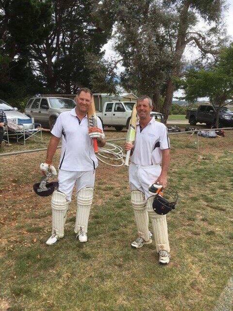FINAL GAME: Geoffrey Nicholson standing with Stuart Parsons at one of their final matches played together. Photo supplied.