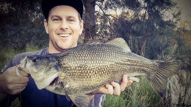 BEAUTY: Recreational fisher, Blake Fallon showing off an Australian Bass.