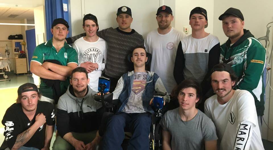 Visit: Bradley Hayes enjoys a visit from the Crookwell Green Devils Youth League players and representatives from the Canberra Raiders.