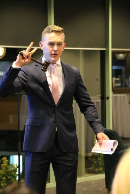 Hamish Gibbs in action at a recent property auction in Sydney. The butcher is retraining as an auctioneer, and taking some of his skill set with him. Photo: supplied