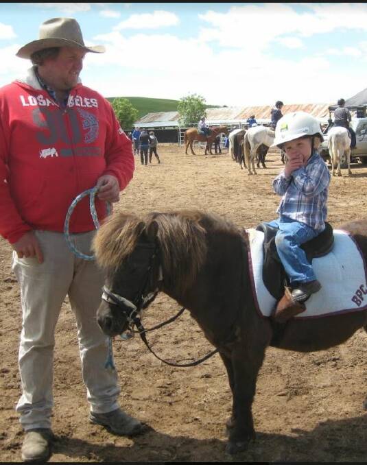 Two-and-a-half year old Bailey Yeo on Charlie with father Matt.