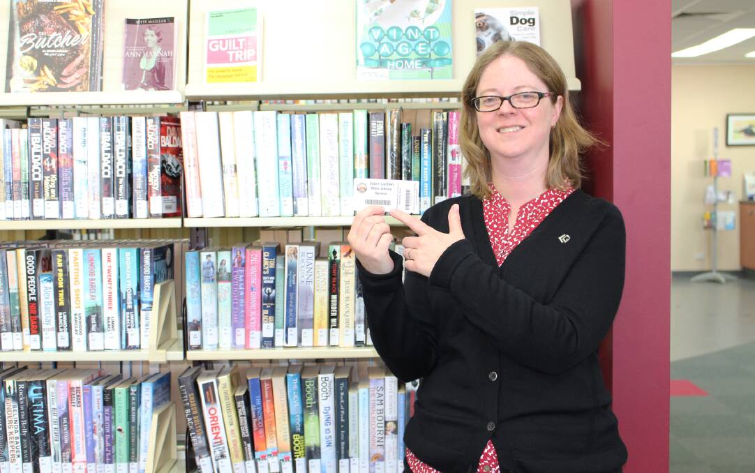 Council’s Manager, Library Services, Michaela Olde with the new Upper Lachlan Shire Library Service Library Card. Photo supplied.