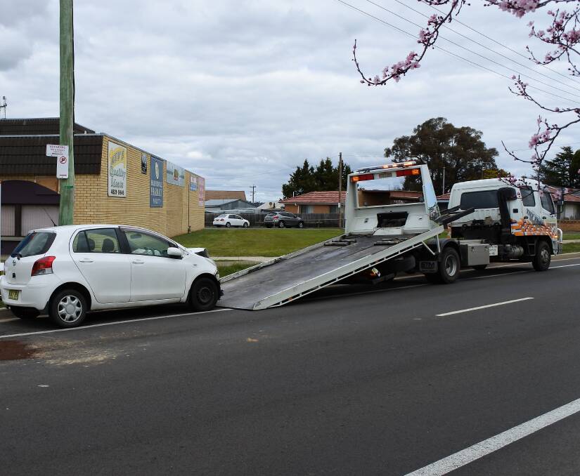 The Toyota Yaris being loaded on the tow truck.
