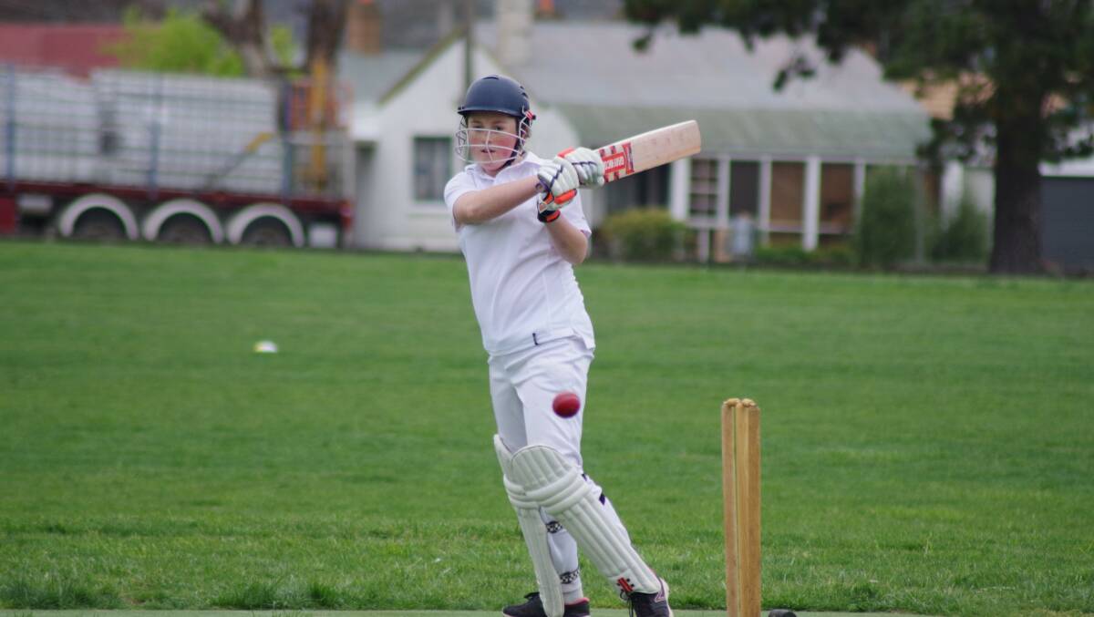 GIRL POWER: Emily Secomb swings into action for the under 16s cricket side. Photos Darryl Fernance.