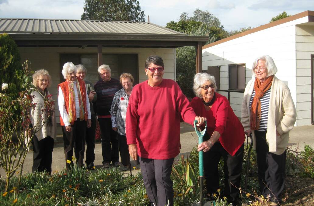 NEVER FORGOTTEN: Gunning Garden club members planting a native in memory of Pauline Wicksteed outside the Tony Foley Centre.