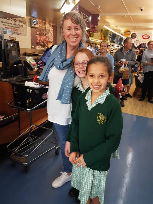 OUT AND ABOUT: St Mary's music teacher Mrs McCarthy enjoyed the visit to the Crookwell IGA with students from the school. Photo: supplied.