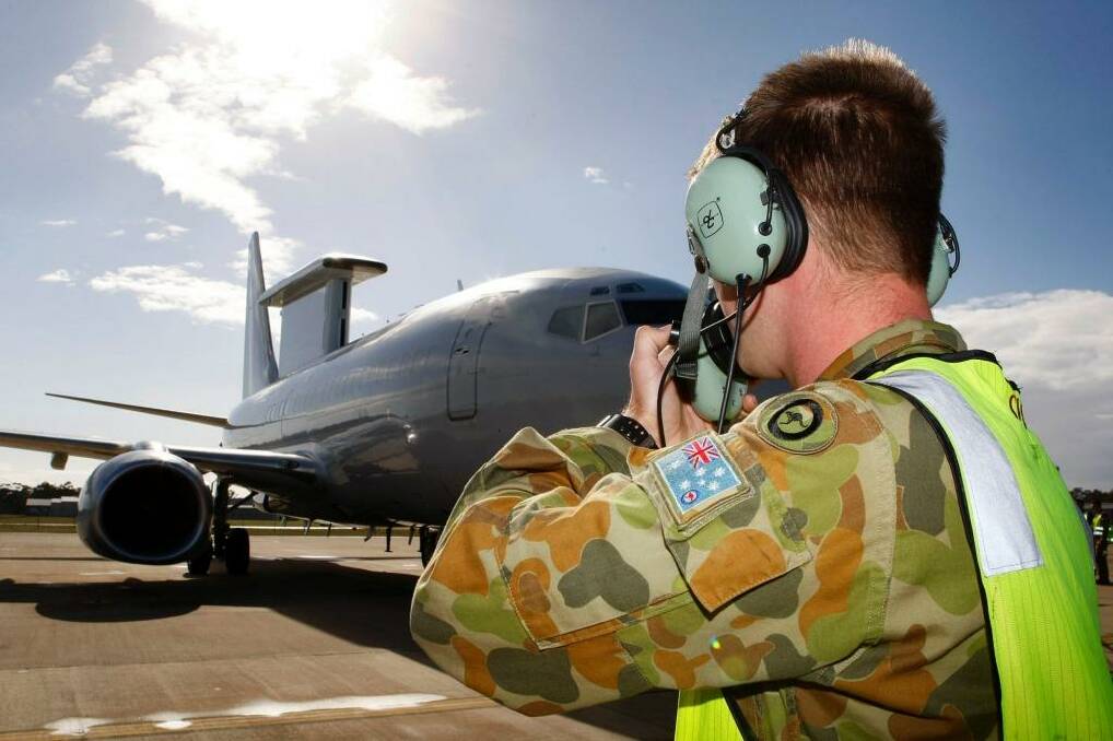 Ground crew prepare a RAAF E-7A Wedgetail Airborne Early Warning and Control aircraft.