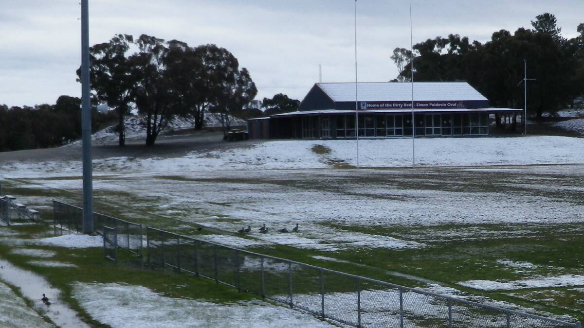 TOO WET: Goulburn Dirty Reds were lucky their games were played in Cooma because with the snow (pictured Friday morning) adding to the already slushy outfield the linesmen, ball boys, water boys, coaches and fence line spectators would have needed gumboots. Photo by Darryl Fernance. 