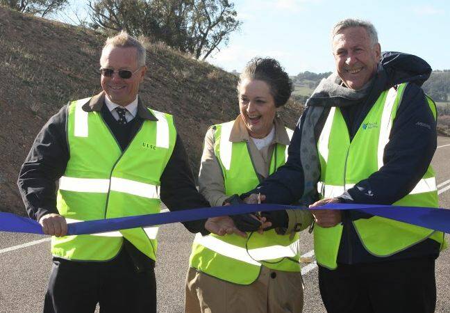 Mayor John Shaw, Member for Goulburn Pru Goward and Minister for Roads Duncan Gay cutting the ribbon to officially open the latest sealed section of the Crookwell to Taralga road. This completes the sealing of the whole road.