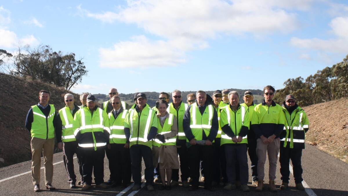 High praise for the team: some of the Upper Lachlan Shire Council workers with Mayor John Shaw, Roads Minister Duncan Gay and Member for Goulburn Pru Goward at the Taralga Road opening ceremony yesterday May 24. 
