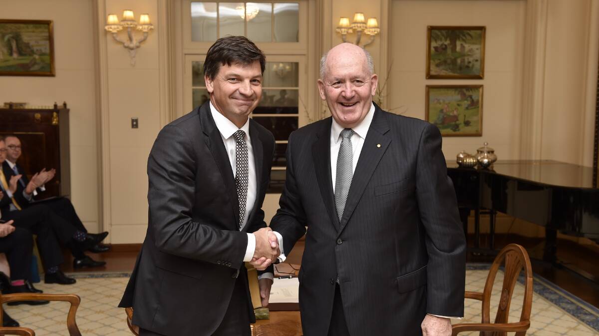 Federal Member for Hume Angus Taylor being congratulated by the Governor General Sir Peter Cosgrove at the swearing in ceremony for the new Coalition ministry recently.
