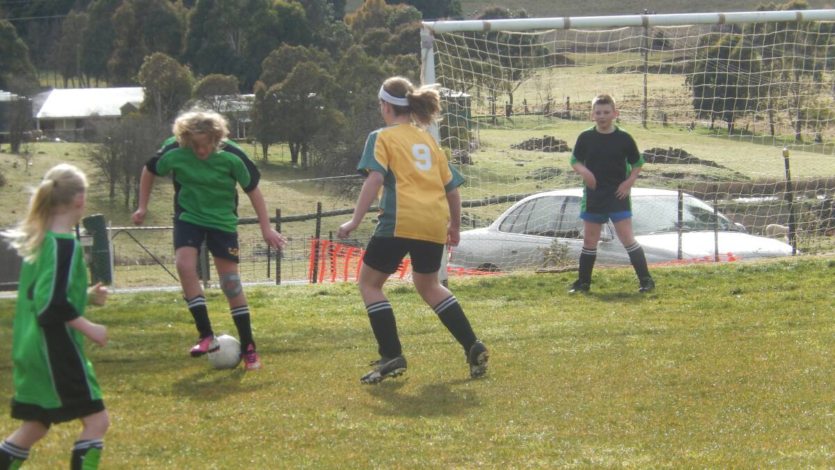  A grade Gold v Green match. (L - R) Green players Charlotte Stephenson, Lucy Opie and Griffyn Bachta in the goal, Gold player is Emily Watt
