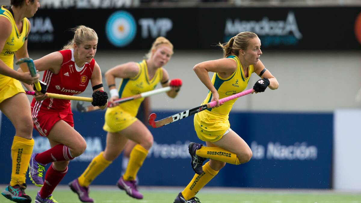 Emily Smith from Crookwell in action leading the others in the England v Hockeyroos at the Champions Trophy November 2014. Photo by Grant Treeby of treebyimages.