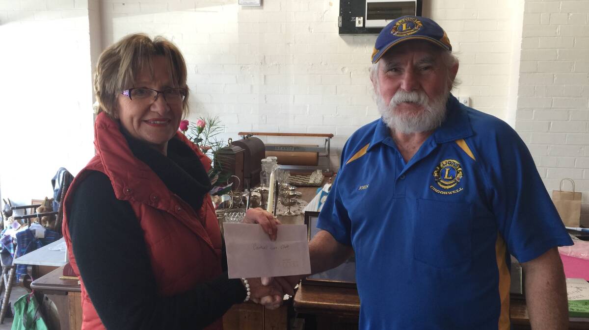 Christine Seaman from Arcadia Crookwell handing over a cheque for $217 to President of Crookwell Lions Mr John Gray that was raised on the appraisals day. These proceeds will go towards the Skate Park.