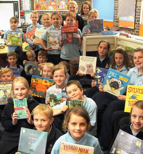 Some of the excited participants who are taking part in the 2016 Premier’s Reading Challenge.
Have fun reading everyone!Participation in the Premier’s Reading Challenge has become one of the highlights of the past few years at Crookwell Public School and this year is proving to be no exception. Students across all classes, K-6 have once again signed up to participate in the 2016 NSW Premier’s Reading Challenge. This reading challenge aims to encourage a love of reading for both leisure and pleasure, in all students, regardless of reading ability. The availability of new books in the library enables them to experience and access a wide range of quality children’s literature, both in their classrooms and in their homes.
“It is a challenge for each student to read, to read more and to read more widely.”
Congratulations to all students who have signed up again this year to read, read and read!