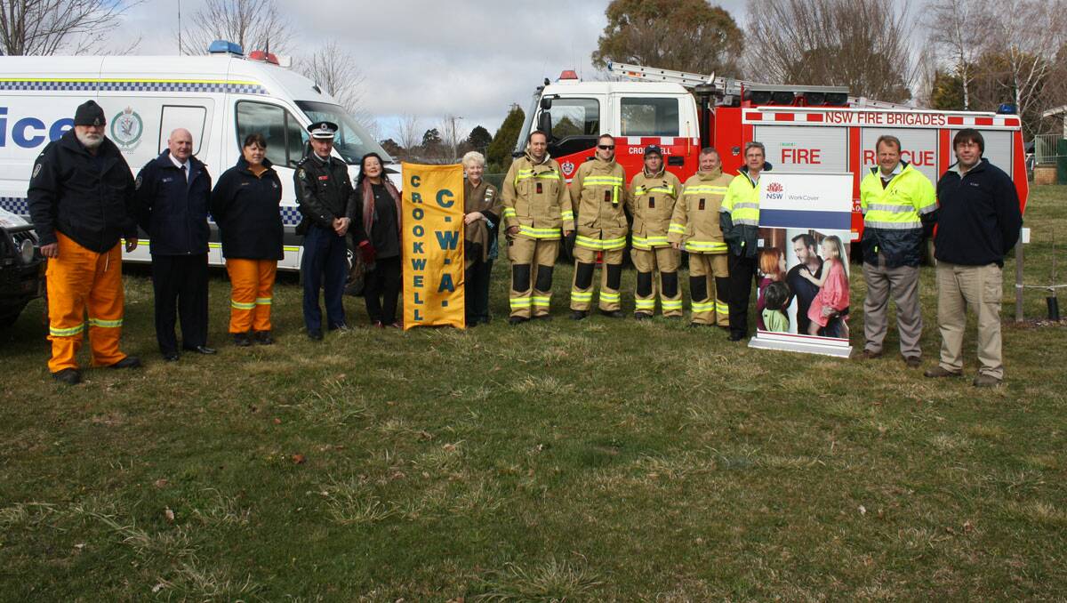 left to right: Norm Fountain, Peter Dyce (Superintendant) and Tracey Anderson from Crookwell Fire Brigade. Rob Post (Inspector Crookwell Police), Susan Reynolds (member) and Lillian Marshall (President Crookwell CWA), Tim Skidmore, Scott Lang, Kevin Lawler and James Kennedy (Crookwell Fire Brigade), Trevor Savage and Steve Charles (WorkCover NSW), Ben Churchill (Upper Lachlan Shire Council Work Health and safety Coordinator) Photo Crookwell Gazette