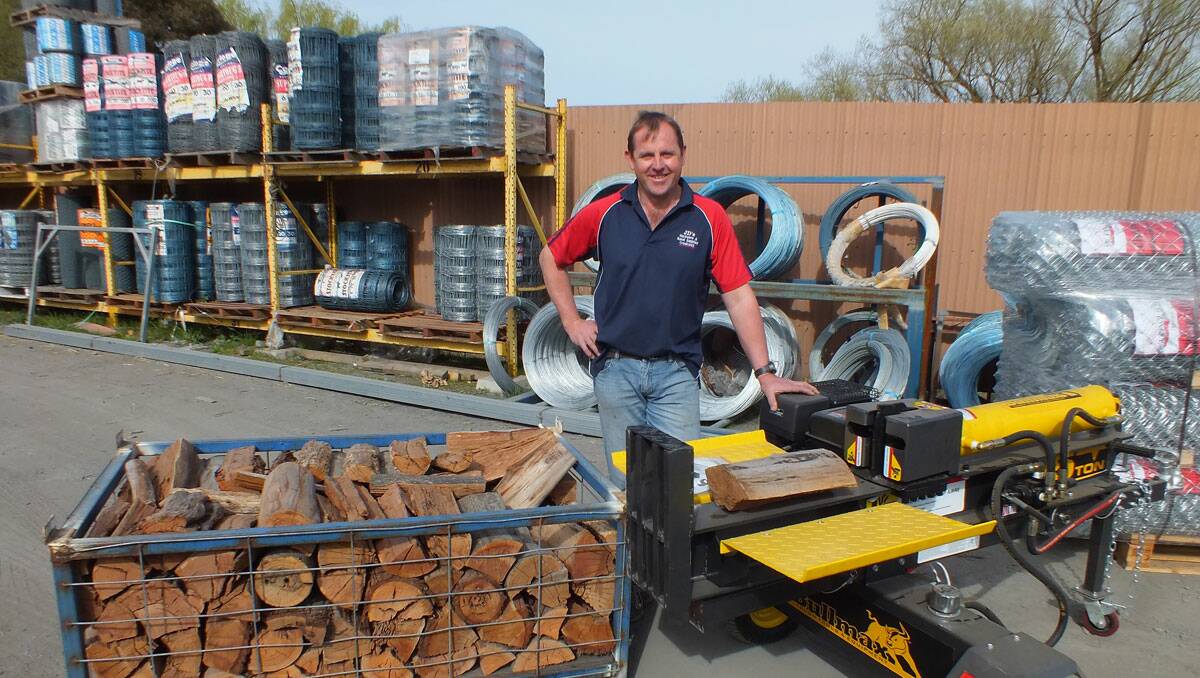 Jason Della of JD’s Hardware and Rural Supplies with his customised log splitter specially redesigned to suit Australian hardwood 