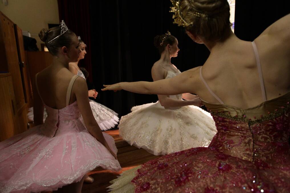 Young ballet dancers Georgia Ireland backstage preparing for the Eisteddfod. Photo: Danielle Smith 