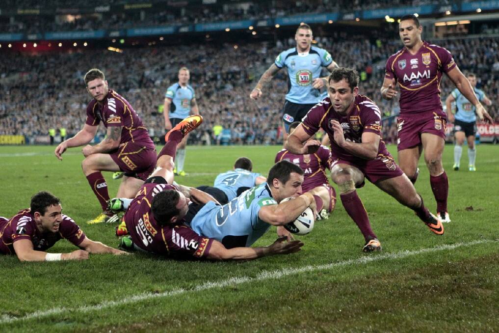 James McManus of the NSW Blues scores a try during the final games of the State of Origin series 2013 at ANZ Stadium in Sydney. Photo: Jonathan Carroll 