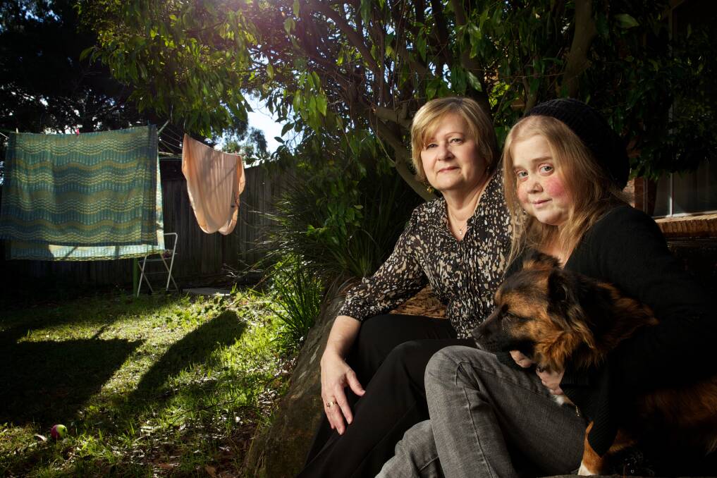 Cystic Fibrosis sufferer Kylie Polglase at her home in Cherrybrook with her mother Rosemary Polglase and her dog Toby.Photo: Wolter Peeters 