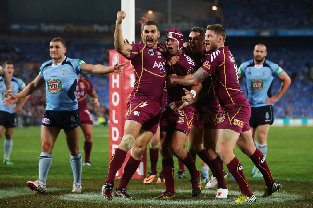 Johnathan Thurston of the QLD Maroons celebrates during the final game in the State of Origin 2013 series at ANZ Stadium in Sydney. Photo: Anthony Johnson 