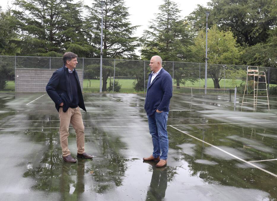 Angus Taylor (L) and Exeter Tennis Club member Greg Wilkins survey the courts. Picture: supplied