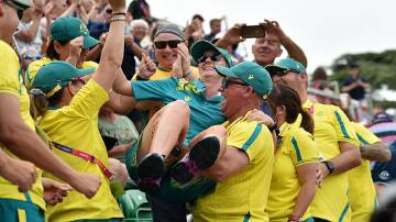 Goulburn's Ellen Ryan is mobbed by her supporters after winning old in the womens' singles at the 2022 Birmingham Commonwealth Games. Photo: Bowls Australia