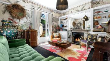 Bold wallpapers and furnishings featured in period rooms with original marble fireplaces. Pic: Supplied