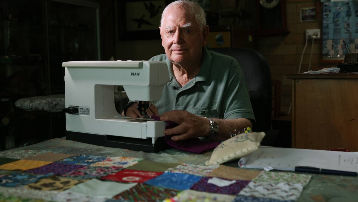 Barry Whitehead sits in front of his sewing machine making a quilt at his Barrack Heights home.. Picture by Sylvia Liber