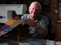 Barry Whitehead sits in front of his sewing machine making a quilt at his Barrack Heights home. Picture by Sylvia Liber