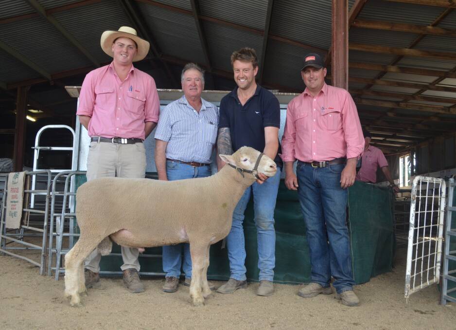 Tom McGregor, Elders, Goulburn, Lindsay Picker, Binda, James Weir, Pinewalla, Crookwell and Daniel Tarlington, Elders, Crookwell with the top priced ram. Mr Picker has been buying Poll Dorsets from Pinewalla for 40 years.
