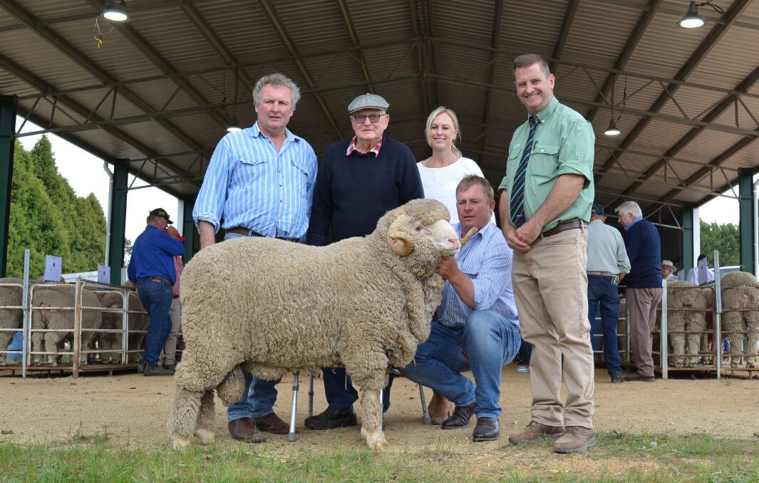 Chris Croker, Ayrston, Golspie, with John Williams, Kristen and Anthony Frost, all of Thalabah, Laggan, and auctioneer, Rick Power, Landmark, Boorowa.