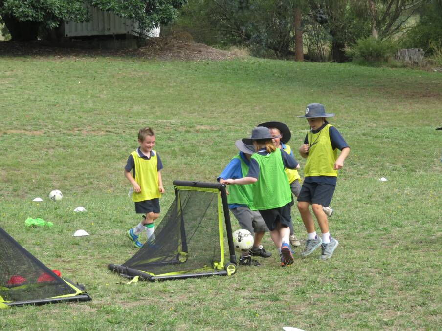 SKILLS: Bigga, Laggan and Binda schools have received specialised soccer training from Canberra player Angelo. Photo supplied.