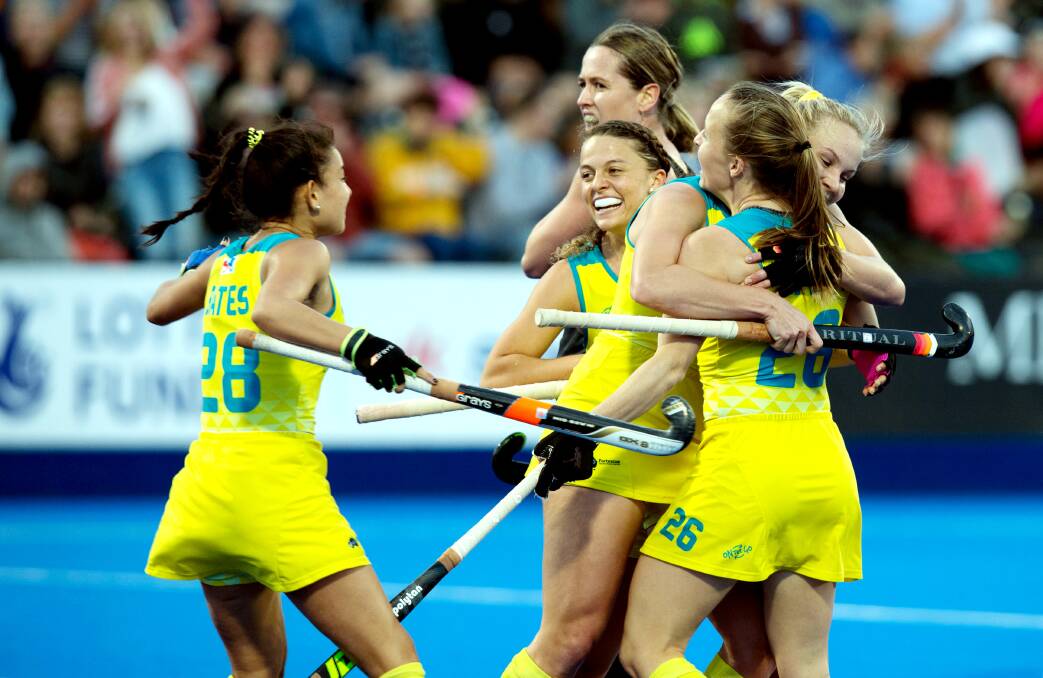 BIRTHDAY GOAL: Emily Smith congratulated by Hockeyroos teammates on her 18th minute equalising goal against New Zealand, on her 26th birthday. Photo: World Sport Pics