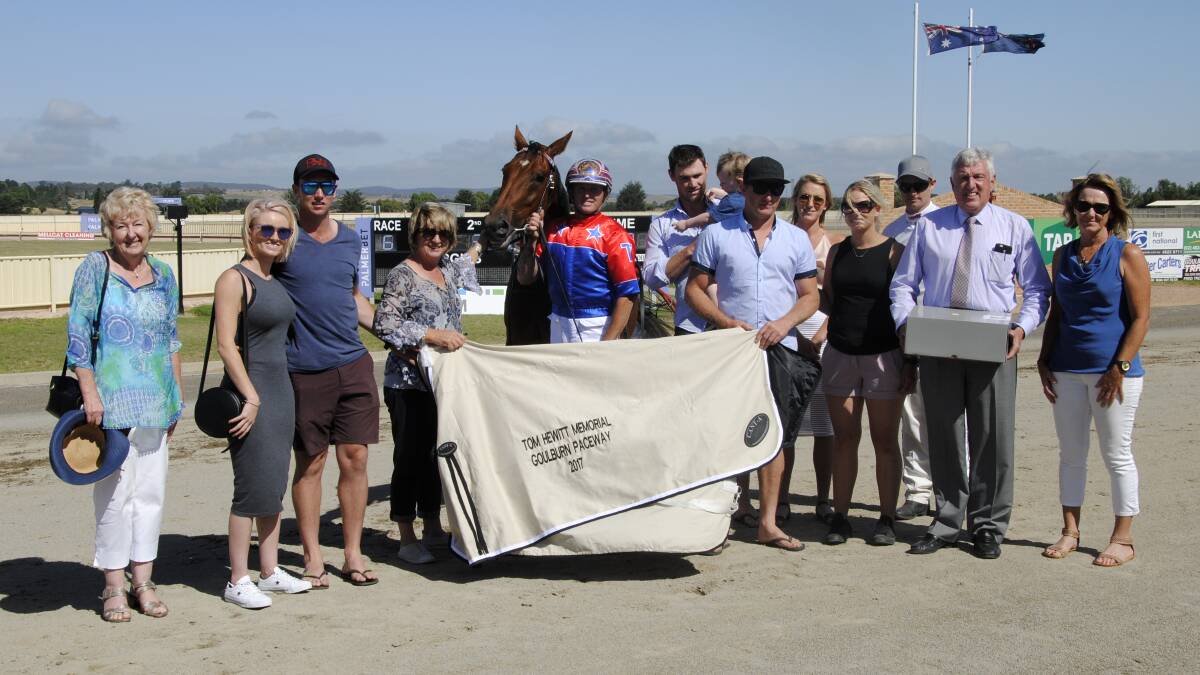 PRESENTATION: The family and connections gathered around last year's winner: Photo: Greig Lord