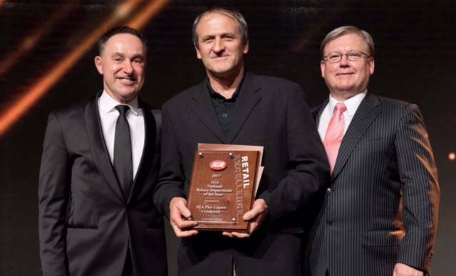 Floyd Davies (centre) pictured at a 2017 business award ceremony for his IGA Supermarket Bakery. Photo supplied.