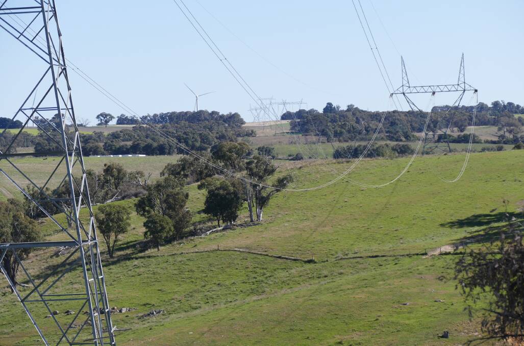 'VISUAL POLLUTION': Wind farms and transmission lines traverse Crookwell district properties. Goulburn MP Wendy Tuckerman and residents want tighter planning guidelines for the infrastructure. Photo supplied. 