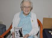 Sr Mary Paulinus Croker will celebrate 80 years as a professed Sister of Saint Joseph on January 19. Here the 101-year-old holds a photo of her late parents, David and Margaret Croker. Picture by Louise Thrower.