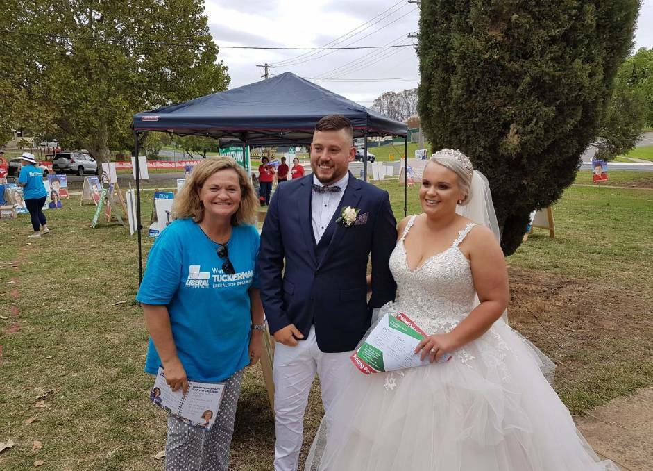 Liberal candidate for Goulburn Wendy Tuckerman met up with newly married Alexander and Taylor Watling on Saturday after they popped in to do their other lawful duty after being married at Saint Saviour's Cathedral that afternoon. Photo supplied.
