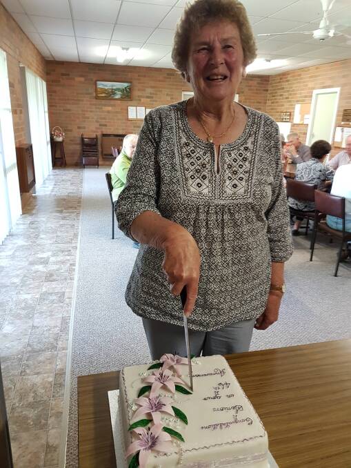 CELEBRATING: Helen Howlett cuts the 46th birthday cake.