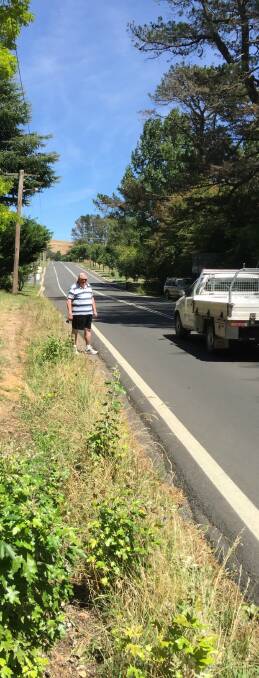 TOO CLOSE: Richard Cromack shows how close traffic is to pedestrians without a footpath either side of Carrington Street's western end. Photo: Bronwyn Haynes