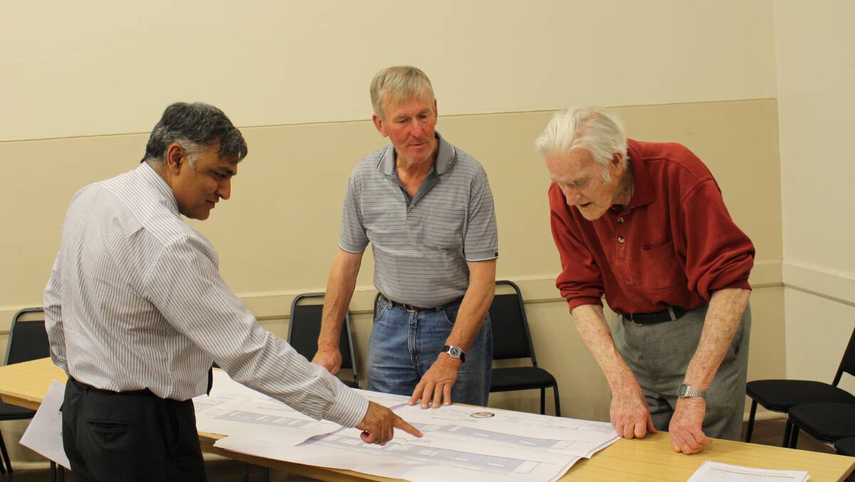 PLANNING: Council’s Director of Works and Operations Mursaleen Shah discusses the preliminary plans with John Broderick and Bruce Belford from the Crookwell Barbell Club.
