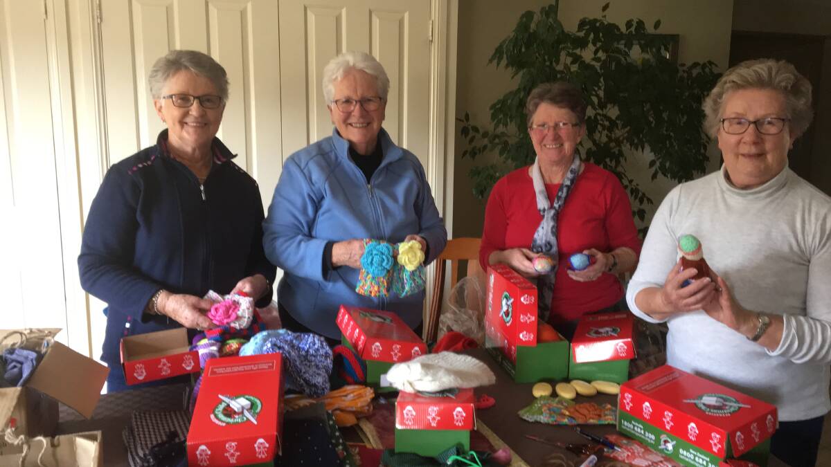 BOXED: Norma Jamieson, Sue Reedy, Ellen Seaman and Pam Evans helping to pack boxes. The generosity of the Crookwell people has been overwhelming again this year.