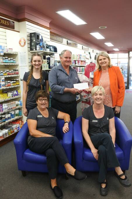 RELAXED: Staff members Rebeka Picker, Narelle Kensit and Marcia Dunn supporting Kerry Leighton (chemist in charge) handing over the cheque to Jo Boyce, CEO Crookwell Taralga Aged Care limited.